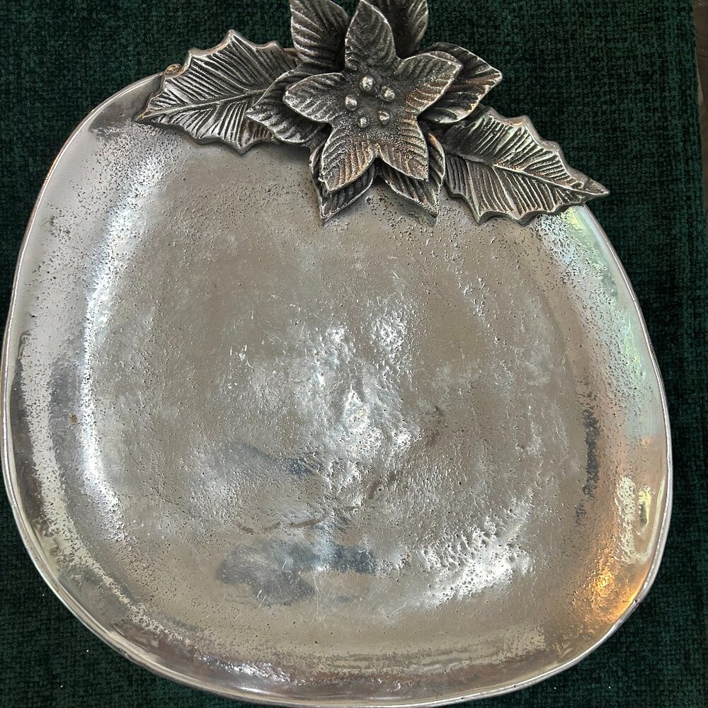 Silver tray with poinsettias design on top